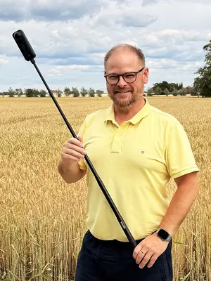 The Insta360 X5 up on its selfie stick